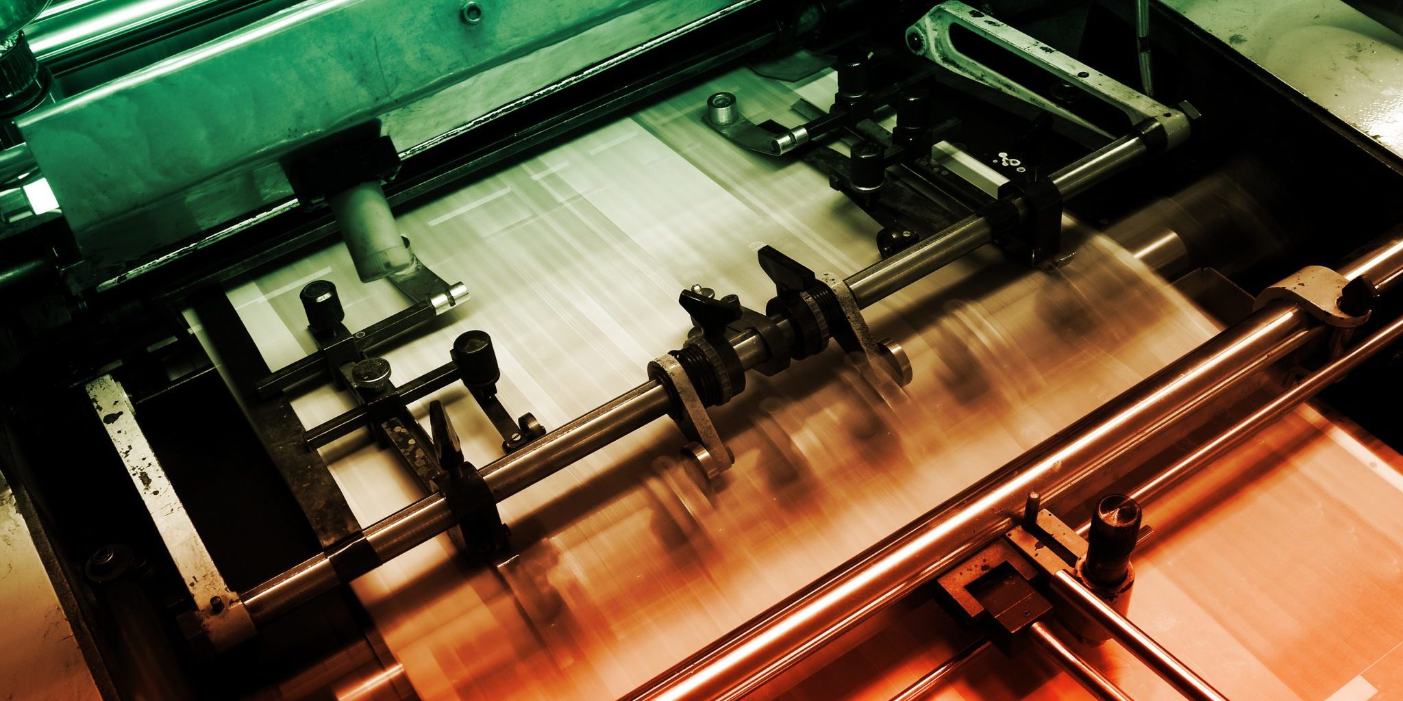 Offset press machine in printing house detail